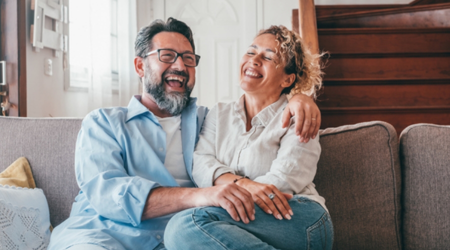 Couple enjoying the savings from refinancing their mortgage with Civic Credit Union.