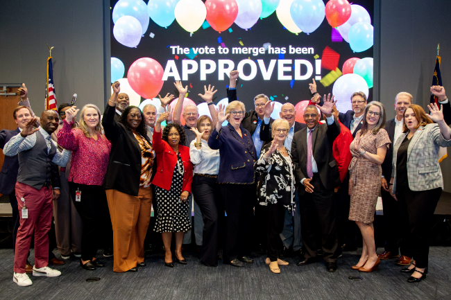 Leadership and the Board of Directs celebrating the approval of the LGFCU and Civic coming together to make one Credit Union. 