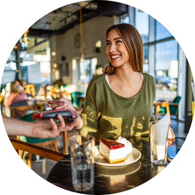 Woman on vacation paying with Civic Rewards Credit Card.