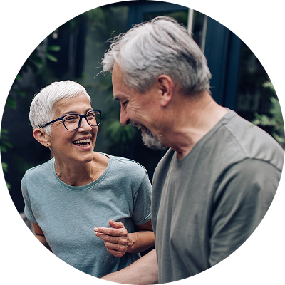 Senior couple celebrating after paying off credit card debt.