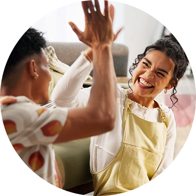 Couple high fives after making plan to payoff bad debt. 