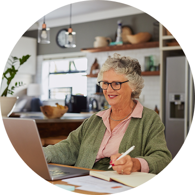 Older woman looking at her savings bonds online. 