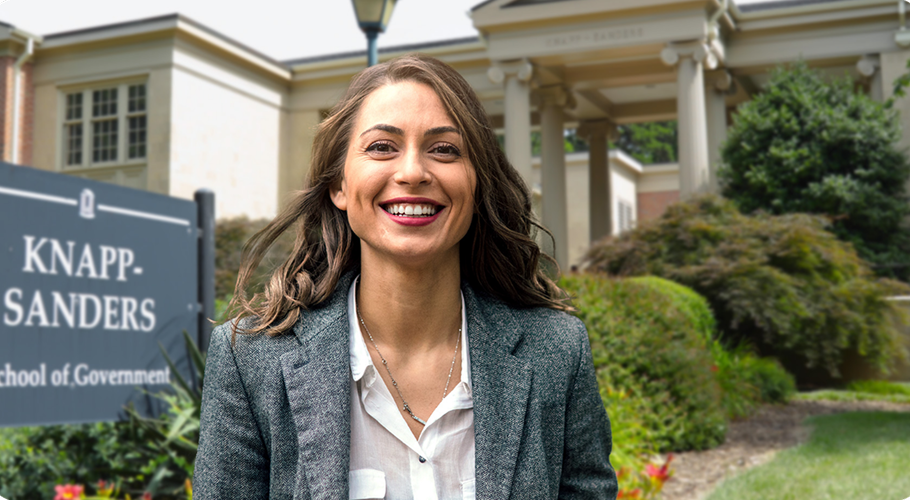 a woman standing in front of the unc school of government
