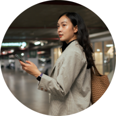 Woman in a airport parking garage looking for her car. 