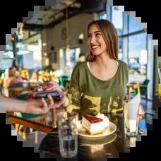 Woman on vacation paying with Civic Rewards Credit Card.