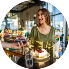 Woman on vacation paying with Civic Rewards Credit Card.