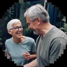 Senior couple celebrating after paying off credit card debt.