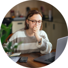 Young woman applying for jobs on her laptop. 