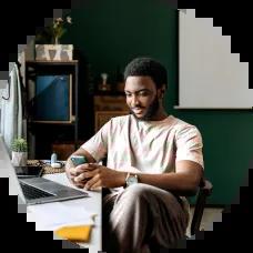 Young guy reading news on the stock market.
