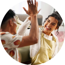Couple high fives after making plan to payoff bad debt.