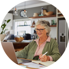 Older woman looking at her savings bonds online.