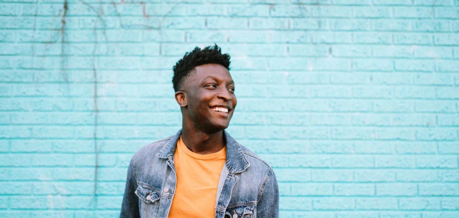 Cheerful man just got a balance transfer with the Civic Classic Credit Card. 