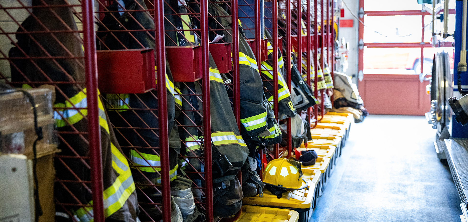 Firefighter equipment next to a fire truck.