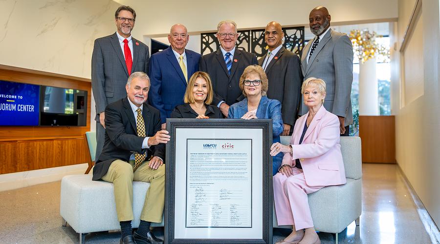 Group photo of the Civic Board of Directors with the signed independence..