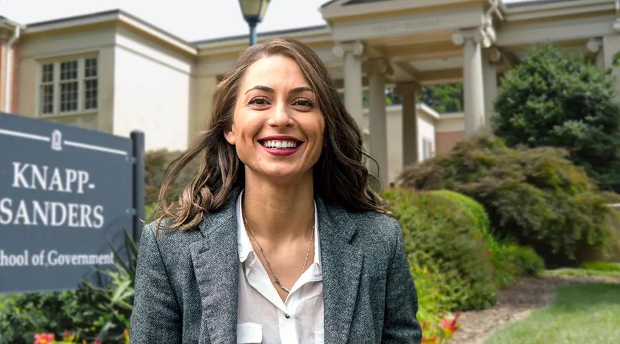 a woman standing in front of the unc school of government