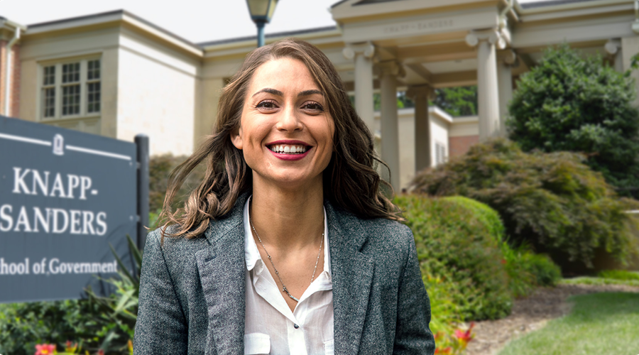 a woman standing in front of the unc school of government
