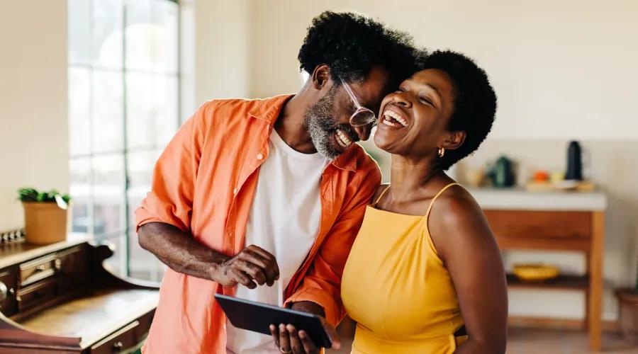 Couple celebrating all the benefits and savings that comes with a Civic Signature+ checking account.
