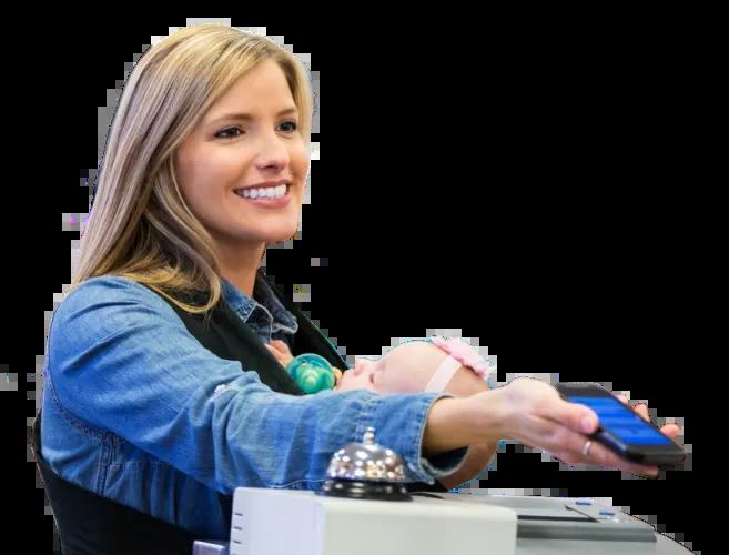 Woman using the Civic app to add cash with a barcode.