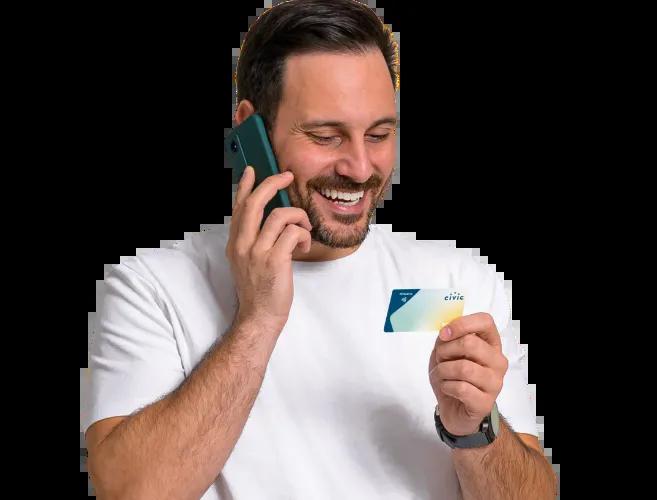 A gentleman on the phone with Visa, exploring all the benefits Visa offers.