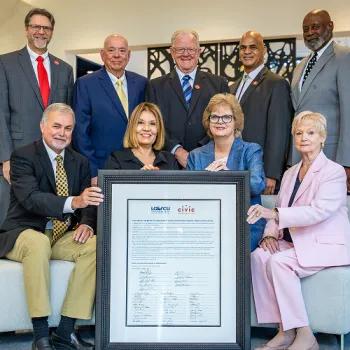 Group photo of the Civic Board of Directors with the signed independence..