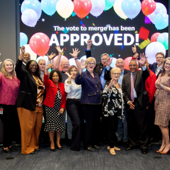 Leadership and the Board of Directs celebrating the approval of the LGFCU and Civic coming together to make one Credit Union. 