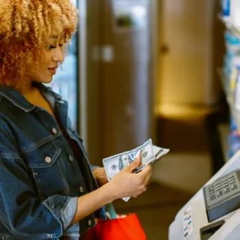 Woman getting cash out of an ATM