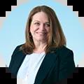 Ashley Ruffin's headshot - Chief Impact Officer on light blue background