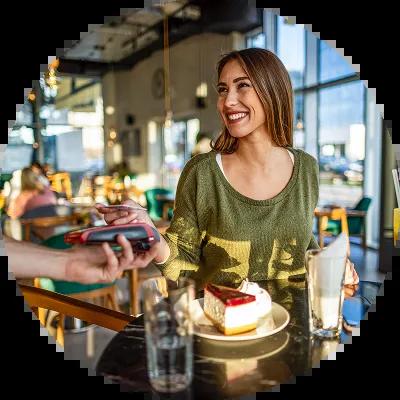 Woman on vacation paying with Civic Rewards Credit Card.