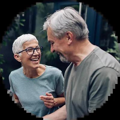 Senior couple celebrating after paying off credit card debt.