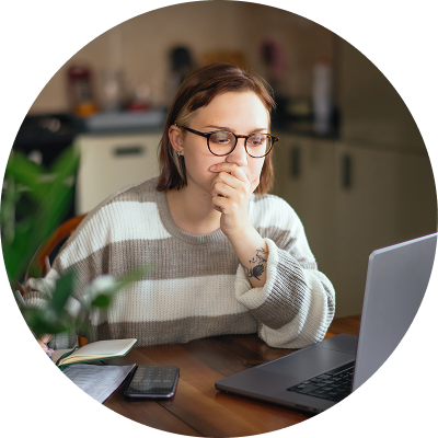 Young woman applying for jobs on her laptop. 