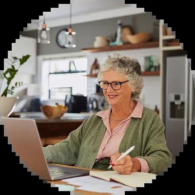 Older woman looking at her savings bonds online. 