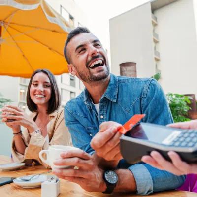 Couple paying for lunch with there Civic Visa Debit Card