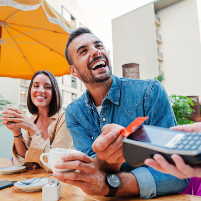 Couple paying for lunch with there Civic Visa Debit Card