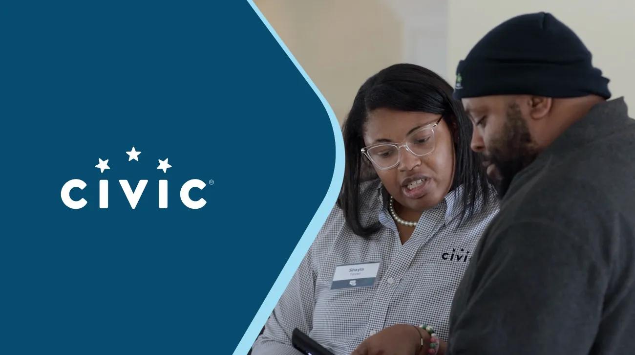 Civic logo and two people looking at a phone together