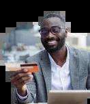 Business owner holding his Civic Business Reward Credit Card while purchasing online.
