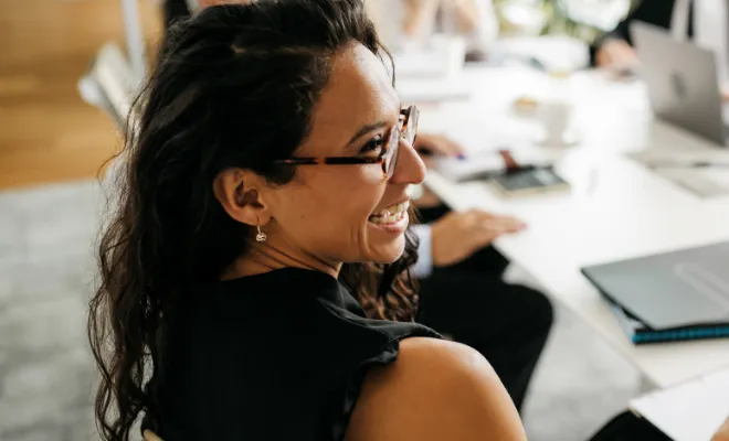 Young business woman in a meeting discussing Civc's Business Line of Credit.