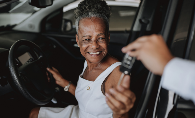 A woman uses her Civic new auto loan to purchase a new car.