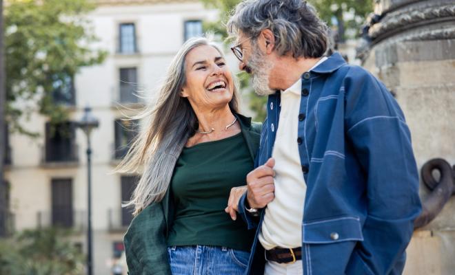 A happy couple enjoying a European getaway, made possible by their high-yield savings from Civic Choice Money Market.