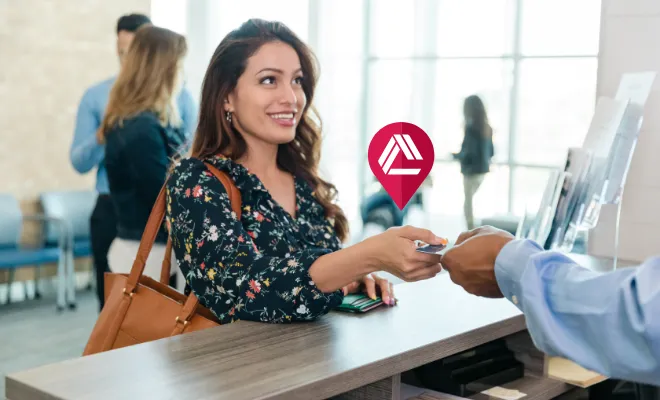 Civic member depositing cash in a Co-op shared Branch location near her home. 