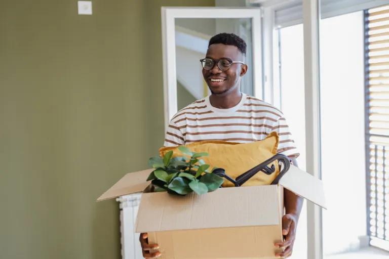 Young man moving into his first home thanks to a Civic Mortgage.