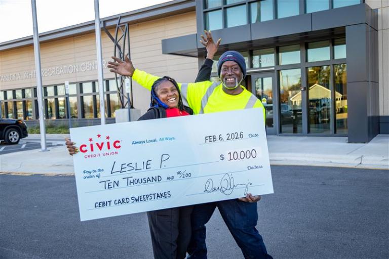 The grand prize winner of $10,000 in our Civic Visa® Debit Card Winter Sweepstakes, Leslie and her husband celebrating with giant check!, 