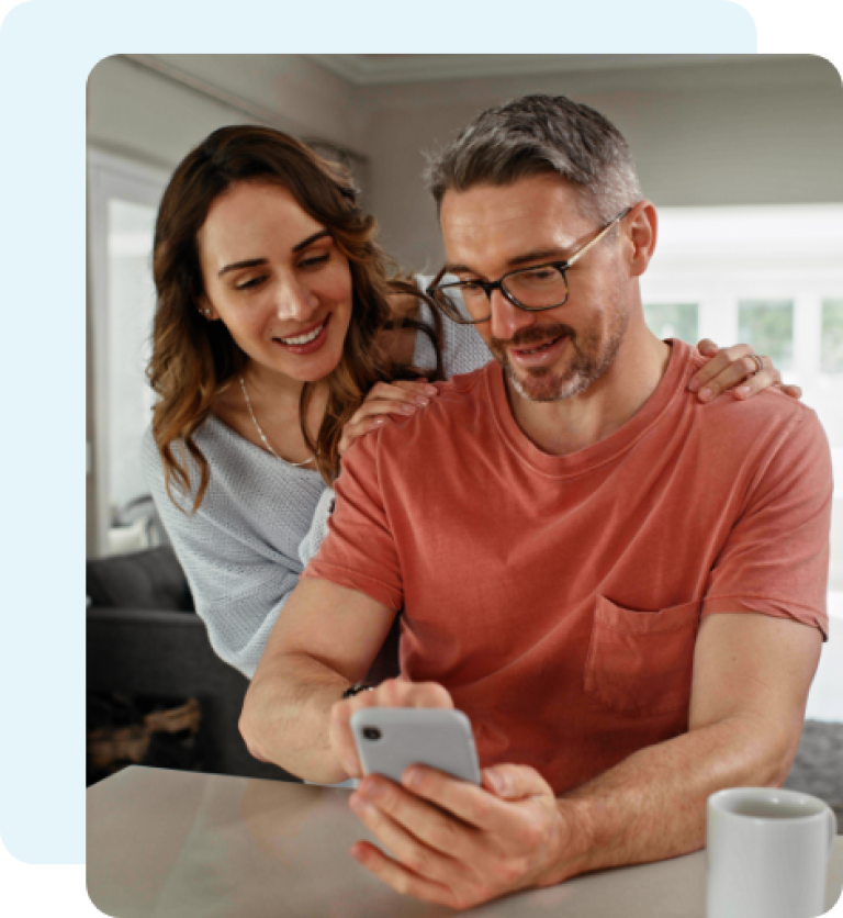 Couple looking at the Civic guides on their phone.