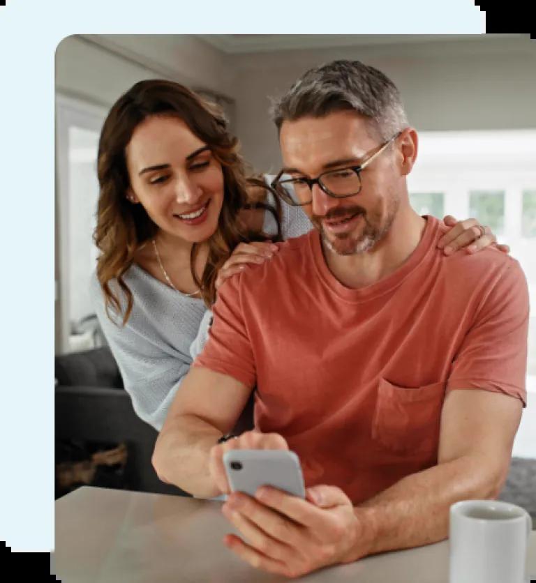 Couple using the Civic Guides on their smartphone.