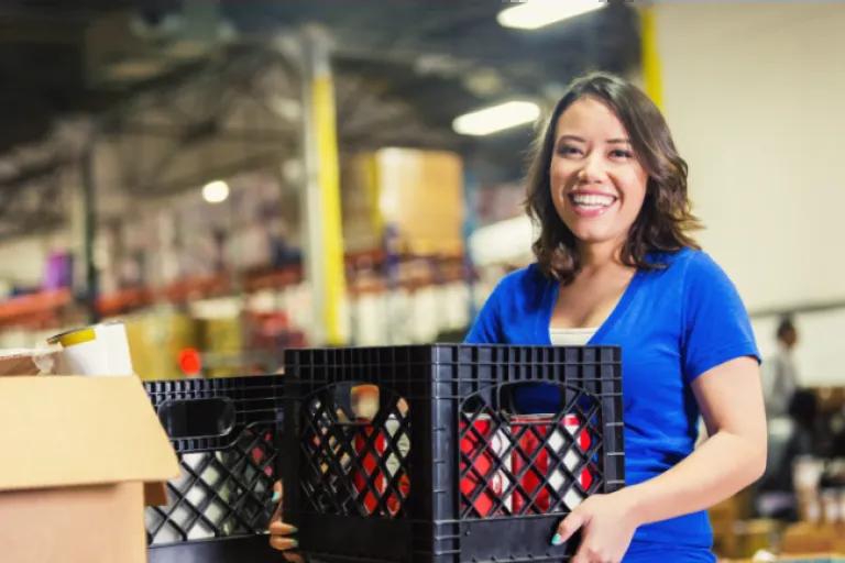 Nonprofit organizer restocking supplies for the organization, supported by the Civic Nonprofit Money Market Account to grow savings faster.