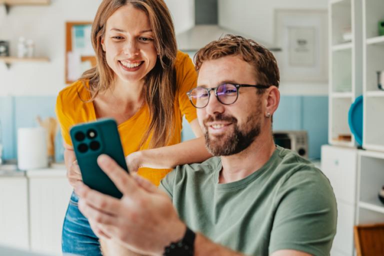 Man showing his wife the new 17 month CD rate promotion