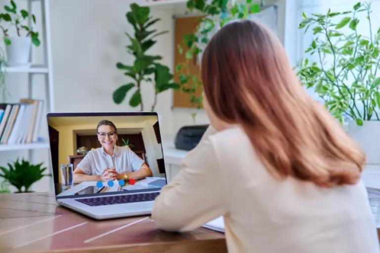 A civic member joins a virtual meeting with the Civic Recovery Assistance team for support in overcoming financial hardship.