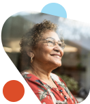 Older woman looking outside thinking about her retirement savings.