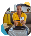 Woman planning her travel with the Civic Rewards Credit Card.