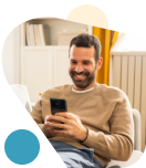 man on his couch banking with Civic.