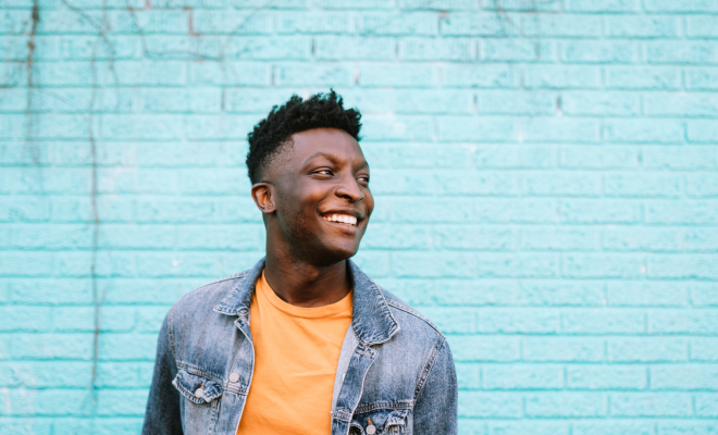 Cheerful man just got a balance transfer with the Civic Classic Credit Card.